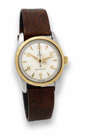 Tudor Steel Gold Oyster.Tudor, Oyster, Shock-Resisting, case No. 136589, Ref. 7904..Made in the 1950's..Fine and rare, center seconds, water-resistant, stainless steel.and 18K yellow gold wristwatch..To be sold without reserve
