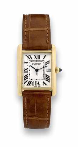 Cartier Tank.Cartier, case No. 368917 MG, Ref. 2441. Made circa 2000..Fine, rectangular, 18K yellow gold quartz wristwatch with.date and an 18K yellow gold Cartier buckle..To be sold without reserve