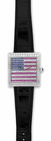 Corum, Buckingham, No. 006/25, Ref. 157.191.69..Made in a limited edition of 25 pieces circa 2006..Fine and unusual, large, square, 18K white gold.wristwatch with diamonds, sapphires and rubies..Accompanied by its original fitted box, warranty card and.op