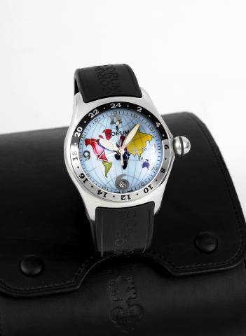 Corum Bubble Two-Time Zone.Corum, Bubble Two-Time Zone, case No..738742, Ref. 383.150.20. Made in the 1990s..Fine and unusual, large and curved, selfwinding.water resistant, center seconds.two-time zone, stainless steel wristwatch.with center-seconds, dat