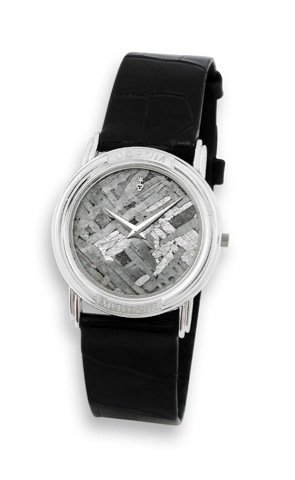 Corum - Platinum - Meteorite Dial.Corum, Meteorite, case No. 408244, Ref. 50450.70. Made in the late 1990s..Very fine, rare and interesting, thin, water-resistant, platinum quartz wristwatch with meteorite dial and a stainless steel.Corum buckle.