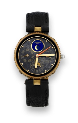 G_rald Genta Gefica.G_rald Genta Gefica, case No. 28600, Ref. G 2796.4. Made in the 1980s..Fine, astronomic, two time zone, water-resistant, bronze and black onyx quartz wristwatch with day and date, moon phases.24-hour indication and a stainless steel an