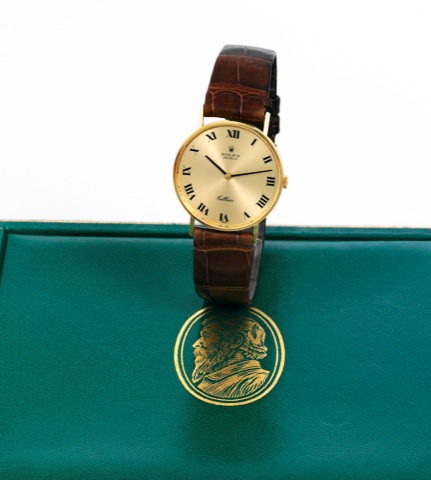 rolex Yellow Gold Cellini.Rolex, Geneve, Cellini, case No. 4086197, Ref. 3833..Sold on August 2, 1977..Fine, thin, 18K yellow gold wristwatch with a yellow.gold-plated Rolex buckle. Accompanied by fitted box.guarantee (now void) and booklet..To be sold wi