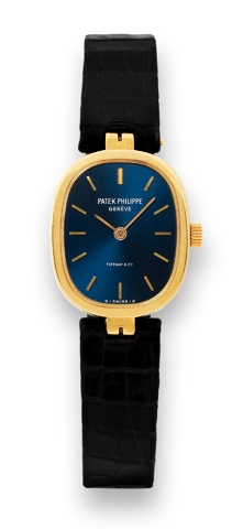 Patek Philippe - For tiffany.Patek Philippe, Geneve, Retailed by Tiffany Co. No..1404472, case No. 558463, Ref. 4554. Made in 1981, sold on November 18th, 1982..Fine and rare, elegant, oval, 18K yellow gold lady