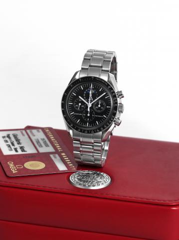 Moon Phase.Omega, Speedmaster Professional, movement and case.No. 77092203, Ref. 35765000. Made in the 2000s..Fine, asymmetric, water-resistant, stainless steel wristwatch.with round button chronograph, moon phases, date.registers, tachometer and a stainl