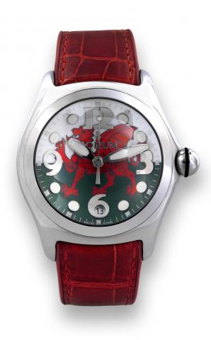 Corum Bubble Limited Edition _ Welsh Flag.Corum, Bubble-Welsh Flag, case No. 648578, Ref. 163.150.20. Made in a limited edition, sold on April 13, 2007..Fine and unusual, center-seconds, quartz, curved, stainless steel wristwatch with date, thick domed cr