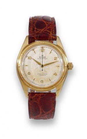 Rolex Big Bubble.Rolex, Oyster Perpetual, Officially Certified Chronometer.case No. 660596, Ref. 5029. Made in 1949..Fine and rare, large, center-seconds, self-winding, waterresistant.18K yellow gold chronometer wristwatch with a.gold-plated Rolex buckle.