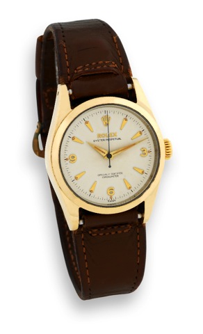 Rolex - Ref. 6634 - Gold Shell.Rolex, Oyster Perpetual, Officially Certified Chronometer.No. N 771633, case No. 243050, Ref. 6634. Made in 1958..Fine and rare, center seconds, self-winding, waterresistant.yellow gold shell over stainless steel wristwatch.