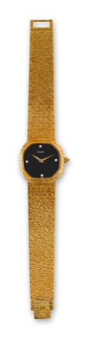 Piaget - Yellow Gold - Onyx Dial.Piaget, movement No. 7807468, case No. 323957.Ref. 9556 A 6. Made in the late 1970s..Very fine, elegant, cushion-shaped 18K yellow gold.wristwatch with a black diamond-set onyx dial and an.integral 18K yellow gold Piaget b