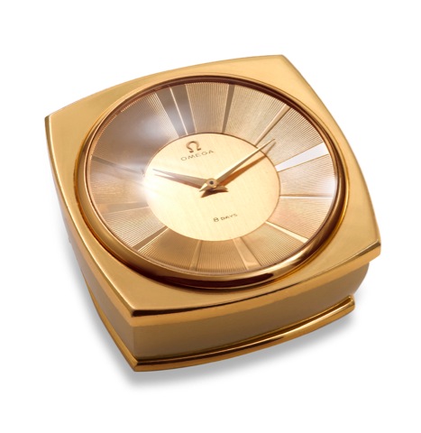Omega, Bienne, Ref. 5540. Made circa 1960..A rare and unusual, heavy, gilt brass 8-day going paperweight.desk clock.