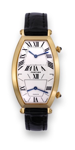 Cartier Two Time Zones.Cartier, Paris, case No. A 108990.Ref. 081-92. Made in the 1990s..Very fine and rare, large, tonneaushaped.curved, water-resistant, two time.zone, 18K yellow gold mid-size quartz.wristwatch with an 18K yellow gold.Cartier deployant 