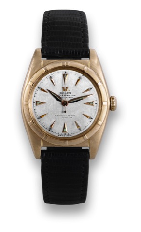 Rolex, Pink Gold Bubble Back, Ref. 5011.Rolex Oyster Perpetual, Officially Certified Chronometer.case No. 648636, Ref. 5011. Made circa 1949, retailed by.Serpico y Laino..Fine and rare, tonneau-shaped, center seconds, self-winding.water-resistant, 18K pin