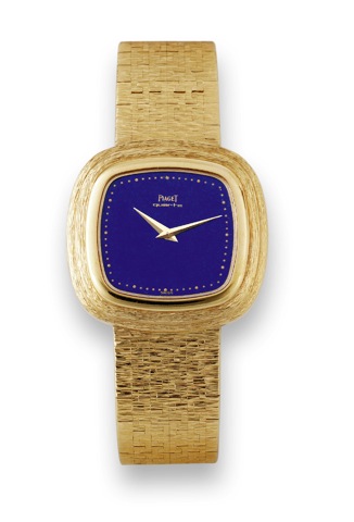 Lapis Lazuli Dial.Piaget, Quartz, case No. 288441, Ref. 75101A6..Made in the 1980s..Fine and elegant, cushion shaped, 18K yellow gold quartz.wristwatch with an 18K yellow gold integrated textured.Piaget bracelet..To be sold without reserve