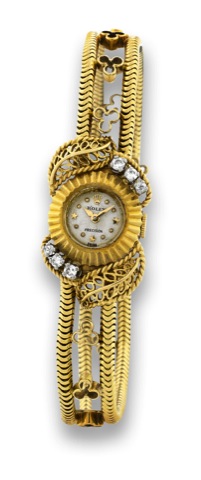 ROLEX _ GOLD AND DIAMOND STAR DIAL.Rolex, Precision, Swiss, Ref. 8792, 1950's..Fine 18K yellow gold lady's wristwatch with diamonds.and an integrated 18K yellow gold bracelet.