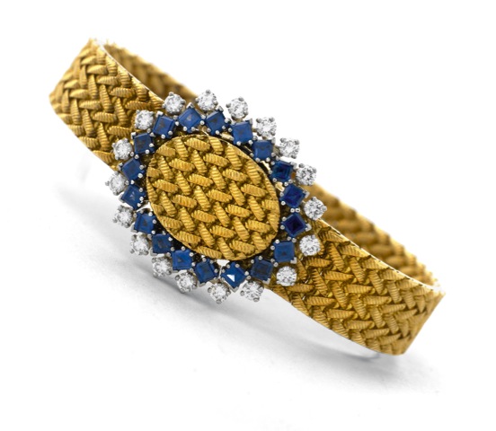 Piaget Diamonds Sapphires.Piaget, Ref.3770 D3, case No. 191927. Made in the 1970's..Very fine and rare 18K yellow gold lady's wristwatch with diamond and.sapphire-set bezel,18K yellow gold Piaget bracelet and sprung cover.