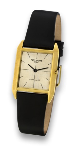 PATEK PHILIPPE _ REF. 3491 _ RETAILED BY.TIFFANY CO..Patek Philippe, Geneve, movement No. 1131915, case.No. 2648791, Ref. 3491. Made circa 1966..Very fine and rare, rectangular, thin, 18K yellow gold.wristwatch.