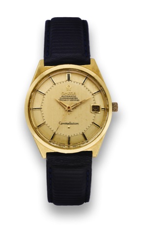 Omega, Yellow Gold Constellation.Omega, Automatic, Chronometer, Constellation.movement No. 27269657, Ref. 168025. Made circa 1968..Fine and rare, center seconds, water resistant, selfwinding.18K yellow gold wristwatch with date and a goldplated.Omega buck