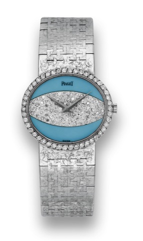 Piaget 18k White Gold, Turquoise.and Diamonds.Piaget, movement No. 771613, case No. 283434, Ref. 9805..Made circa 1970..Fine, 18K white gold lady's wristwatch with turquoise and.diamond dial and an integral Piaget 18K white gold bracelet.