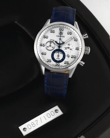 TAG HEUER - CARRERA - WHITE GOLD.CHRONONOMETER - CHRONO.Tag Heuer, Carrera, No. 087/100, No. 1643684.Ref. CV 5040. Made in 2006, sold April 4, 2007..Fine and rare, self-winding, water resistant, 18K white gold.wristwatch, with date, round button 1/100 of 