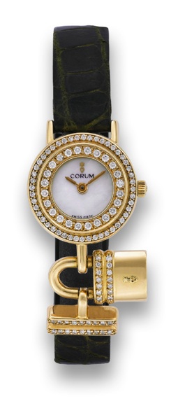 CORUM TIME LOCK.Corum, No. 461820, Ref. 24.140.65. Made in the 1990's.Fine and unusual, circular, 18k yellow and diamond lady