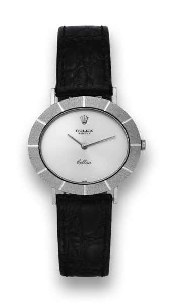 ROLEX REF. 3881 WHITE GOLD CELLINI.Rolex, Geneve, Cellini, case no. 3230602, Ref. 3881. Made.in the 1970's..Fine, thin, horizontal oval, 18K white gold wristwatch with a.stainless steel Rolex buckle. Accompanied by fitted box and.warranty (now void).