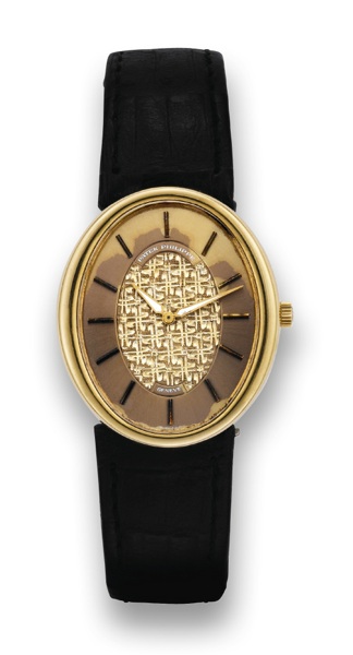 PATEK PHILIPPE REF. 3798 YELLOW GOLD.Patek Philippe, Geneve, movement No. 1323009, case.No. 535893, Ref. 3798. Made circa 1976..Fine and unusual, oval, 18k yellow gold wristwatch with.luminous hands.