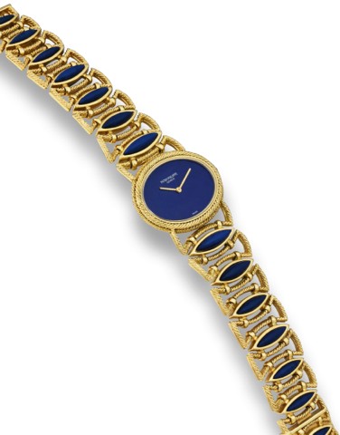 PATEK PHILIPPE REF. 4290, YELLOW GOLD AND LAPIS LAZULI.Patek Philippe, Geneve, Joailllerie, movement No. 1397691, case No. 2765627.Ref. 4290-1. Made circa 1980..Very fine and rare, horizontal oval, 18K yellow gold and lapis lazuli lady