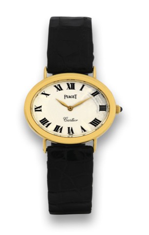 PIAGET REF. 9852 RETAILED BY CARTIER.Piaget, case no. No. 163928, Ref. 9852. Made in the 1970s..Fine, horizontal oval, 18K yellow gold mid-sized wristwatch.with an 18K yellow gold Piaget buckle.