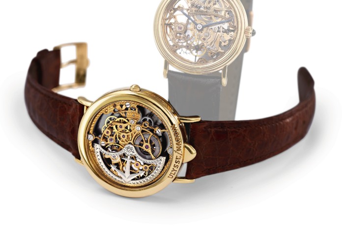 ULYSSE NARDIN SKELETONIZED INVERSED DIAL.Ulysse Nardin, Locle, Suisse, No. 122, Ref.141 28. Produced.in the 1980's..Fine, rare and unusual, skeletonized, self-winding 18k yellow.gold wristwatch with hinged inversed dial and18k yellow gold.Ulysse Nardin bu