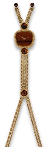 PIAGET TIGER'S EYE AND GOLD NECKLACE.Piaget, No. 205695, Ref. 9465P67. Made in the 1980s..Very fine, rare and elegant, 18K yellow gold and Tiger's Eye.pendant watch with integral 18K yellow gold twisted-link.necklace.