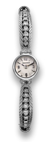 JAEGER LECOULTRE WHITE GOLD DIAMOND.Jaeger-LeCoultre, case No. 87679A. Made in the 1960s..Fine and elegant, 18K white gold and diamond lady's wristwatch with back winding and articulated integral 18K.gold and diamond bracelet.