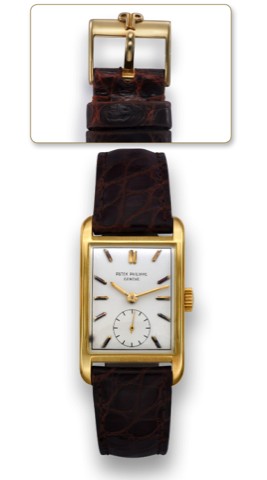 PATEK PHILIPPE REF. 2434 YELLOW GOLD.Patek Philippe Cie, Geneve, No. 976329, case No. 682549.Ref. 2434. Made circa 1954..Fine and rare rectangular 18k yellow gold wristwatch with 18k.yellow gold Patek Philippe buckle.