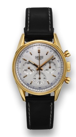 HEUER CARRERA GOLD RE-EDITION.Heuer Carrera Chronograph, Carrera, 1964 re-edition.movement No. 4508111, case No. 0518, Ref. CS3140. Made.in a numbered series circa 1996..Fine, water resistant, 18K yellow gold wristwatch with round.button chronograph, regi