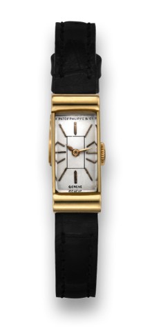 PATEK PHILIPPE REF. 1043 YELLOW GOLD.Patek Philippe Co., Geneve, movement No. 840826, case.No. 505961, Ref. 1043. Made in 1938, sold on October.1st,1938..Fine, rectangular, 18K yellow gold lady