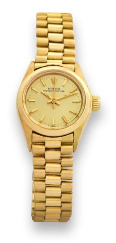 ROLEX - REF. 6718 - LADY'S.Rolex, Oyster Perpetual, case No..4110194, Ref. 6718/6719. Made in 1975..Fine, center seconds, self-winding, waterresistant.18k gold lady's wristwatch with.an 18k yellow gold Oyster bracelet.
