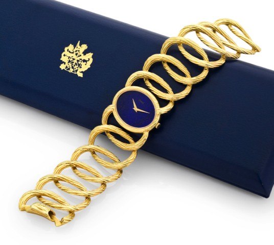 PIAGET, REF. 9852D65 YELLOW GOLD LAPIS.LAZULI BRACELET WATCH.Piaget, No. 194854, Ref. 9852D65. Made circa 1980..Very fine and elegant, 18K yellow gold lady’s bracelet watch.with lapis lazuli dial and integral 18K yellow gold Piaget.bracelet. Accompanied