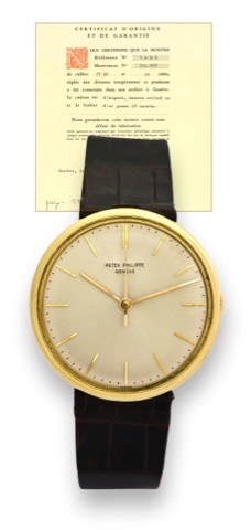 PATEK PHILIPPE REF. 3495.DISCOVOLANTE, ORIGINAL.CERTIFICATE.Patek Philippe, Genève, movement No..711555, case No. 431632, Ref. 3495..Sold on November 22nd, 1965..Very fine and rare, center seconds, 18K.yellow gold wristwatch with an 18K yellow.gold Patek 