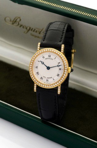 BREGUET, REF. 8561 - LADY’S CLASSIQUE.DIAMOND SET WATCH.Breguet, Classique, No. 1666, Ref. 8561. Made in the 1990s..Very fine and elegant, lady’s 18K yellow gold and.diamond-set wristwatch with an 18K yellow gold Breguet.buckle. Accompanied by a Breguet b