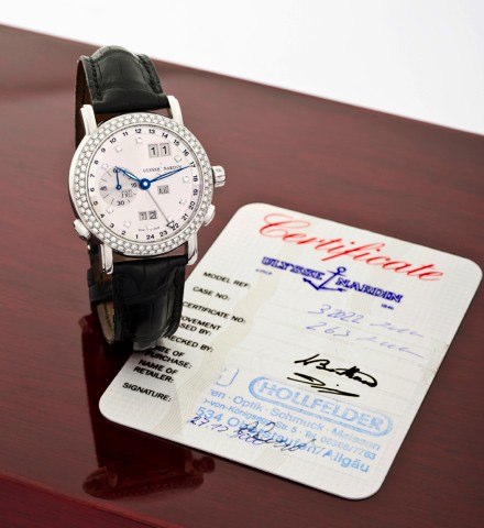 ULYSSE NARDIN REF. 320-22 WHITE GOLD AND.DIAMOND PERPETUAL CALENDAR - GMT.Ulysse Nardin, Locle Genève, Perpetual Calendar – GMT,.No. 263, Ref. 320-22. Sold on December 27th, 2000..Very fine, self-winding, water-resistant, two time zone, 18K.white gold w