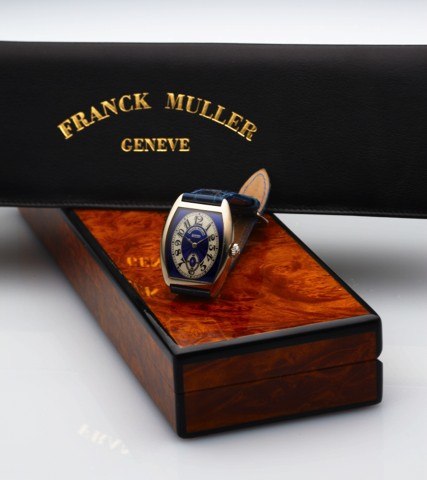 FRANCK MULLER REF. 7502 S6 WHITE GOLD.Franck Muller, Genève, Cintrée Curvex, No. 44. Ref. 7502 S6..Made in the 1990s..Very fine, curved tonneau-shaped, water-resistant, 18K white.gold wristwatch with an 18K white gold Franck Muller buckle..Accompanied wit