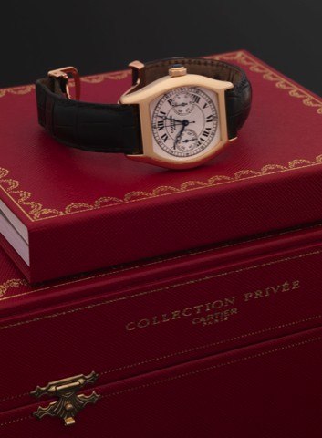 CARTIER REF. 2356 TORTUE CHRONOGRAPH YELLOW GOLD.Cartier, Swiss, Tortue Chronograph, No. 0190 CC, Ref. 2356. Made in 2001..Very fine, tonneau-shaped, water resistant, 18K yellow gold wristwatch with single button chronograph, register and an 18K yellow.go
