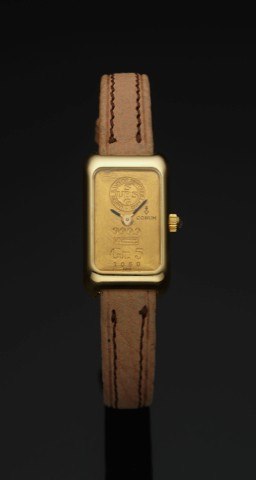 CORUM GR.5 GOLD INGOT WATCH.Corum, Ingot Watch, No. 1060, Ref. 14300, case No. 343855..Made circa 1980..Fine, rectangular 18K yellow gold and diamond wristwatch.made of a 5 gram 999.9 gold ingot..To be sold without reserve