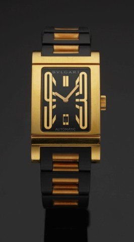 BULGARI REF. RT 45 G RETTANGOLO YELLOW GOLD.Bulgari, Rettangolo, Automatic, case No. L2212, Ref. RT 45 G..Made circa 2002..Fine, rectangular, self-winding, water-resistant, 18K yellow.gold wristwatch with date and a Bulgari rubber link bracelet.with 18K g