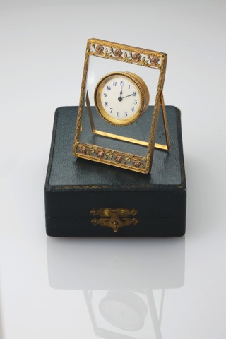 LENOIR STRUT CLOCK GILT.BRASS AND GLASS.Lenoir, Swiss. Made circa 1915..Gilt brass and glass strut clock. Accompanied.by a fitted box..To be sold without reserve
