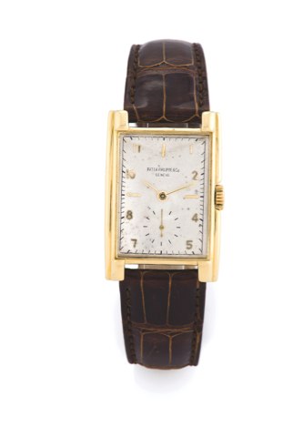 Patek Philippe Ref. 1570.Patek Philippe Cie, Genève, No. 838768, case No. 642122, ref. 1560. made circa 1952..Very fine and rare, large, rectangular curved, 18K yellow gold wristwatch with an 18k.yellow gold patek philippe buckle.