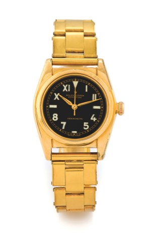 ROLEX REF 5015 BUBBLEBACK - BLACK CALIFORNIA DIAL.Rolex, Oyster Perpetual Chronometre, Ref. 5015. Made circa 1950..Fine and rare, tonneau-shaped, center seconds, self-winding, water-resistant, gold-plated and stainless steel wristwatch with a gold-plated 