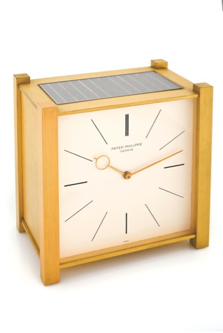 PATEK PHILIPPE SOLAR CLOCK.Patek Philippe, Genève, Pendulette, movement No. 873422.case No. 999, Ref. 1675. Made circa 1963..Fine and rare, solar-powered gilt-brass brass table clock with.electrically-wound remontoir.