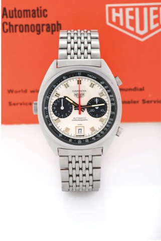 HEUER, REF. 11531. CARRERA LEFT-HAND CROWN.Heuer, Carrera Automatic Chronograph, No. 285853, Ref. 11531. Sold on August 14th, 1976..Fine, tonneau-shaped, self-winding, water-resistant, stainless steel wristwatch with round button chronograph, registers, d