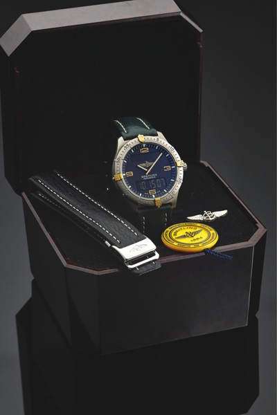 BREITLING REF. F56062.AEROSPACE TITANIUM AND GOLD.Breitling, Genève, Aerospace, No. 08707, Ref. F 56062..Made in the 1990’s..Fine, two time zone, water-resistant, titanium and gold.quartz wristwatch with timer, chronograph to 1/100th.seconds, a