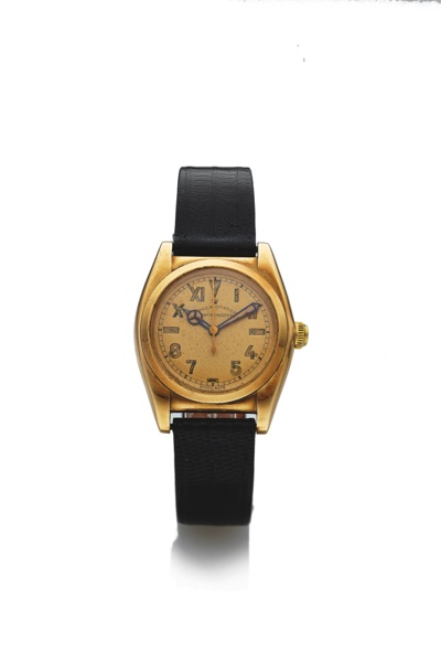 ROLEX REF. 3009 CHRONOMETER.CALIFORNIA DIAL YELLOW GOLD.Rolex, Oyster, Chronometer, No. 12818, Ref. 3009. Made in the early 1940s..Fine and rare, tonneau-shaped, center seconds, water-resistant, 14K yellow gold wristwatch.